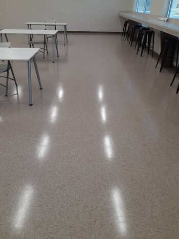 Brantley Solutions, LLC janitor in Rockbridge, GA mopping floor.